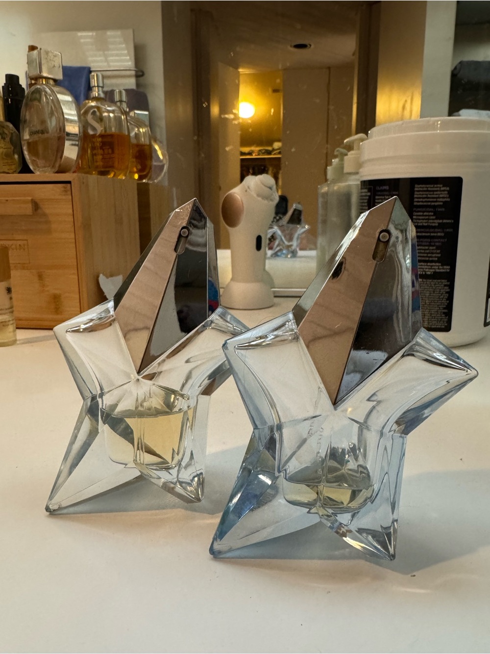 Angel by Thierry Mugler 2 bottles, 1/10th full and the other is 1/3rd full.
